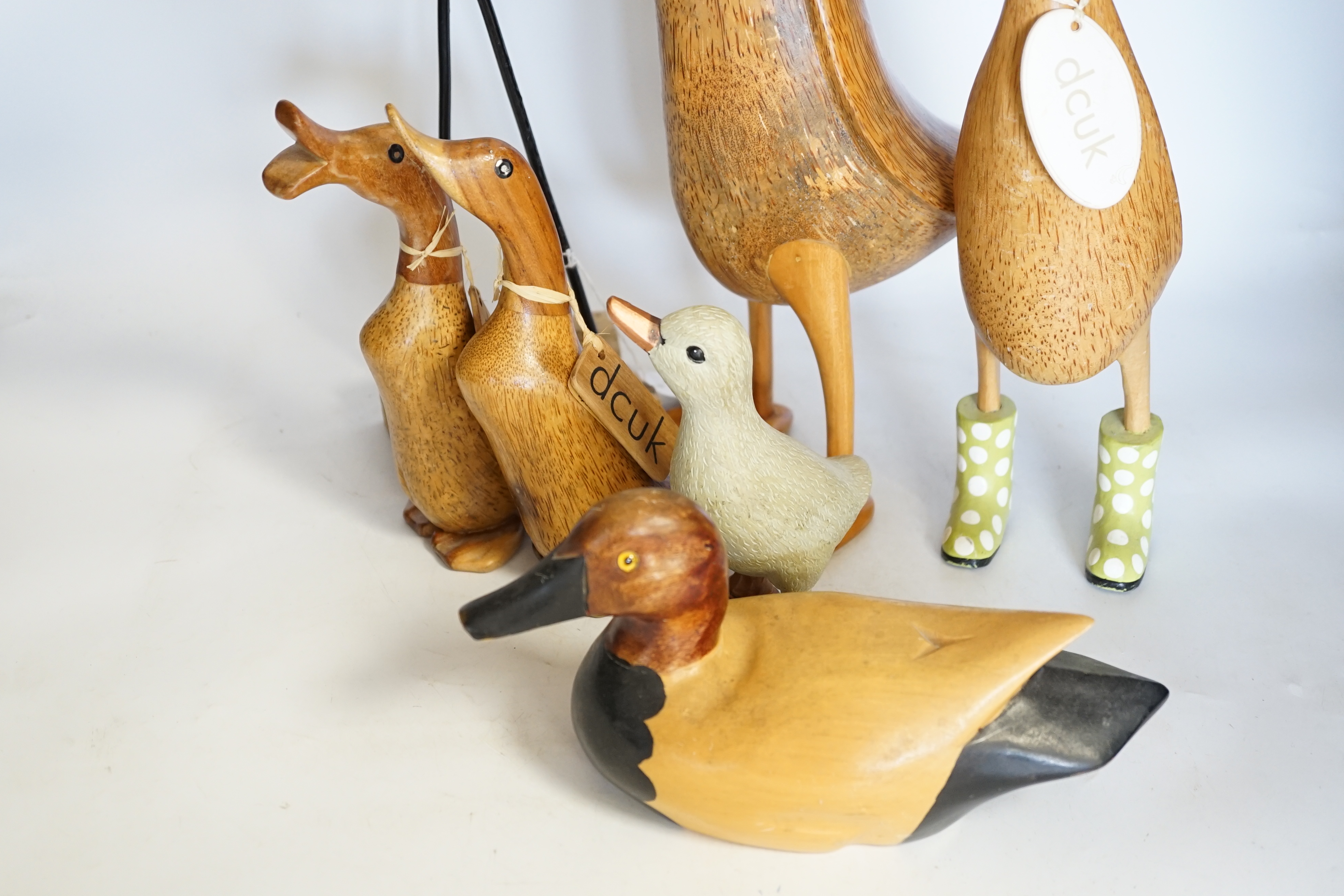 A collection of wooden painted ducks and waders